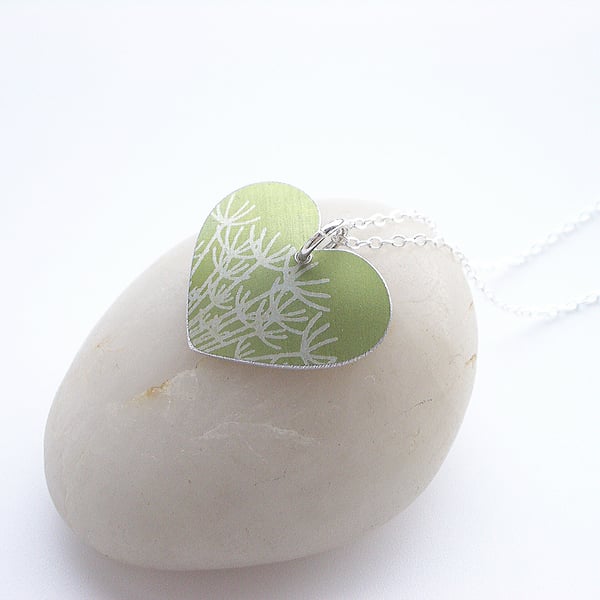 Green heart pendant necklace with dandelion seeds