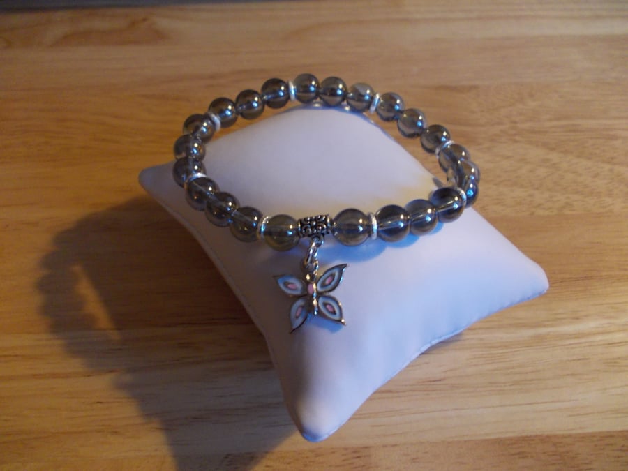 Silver coated quartz elasticated charm bracelet