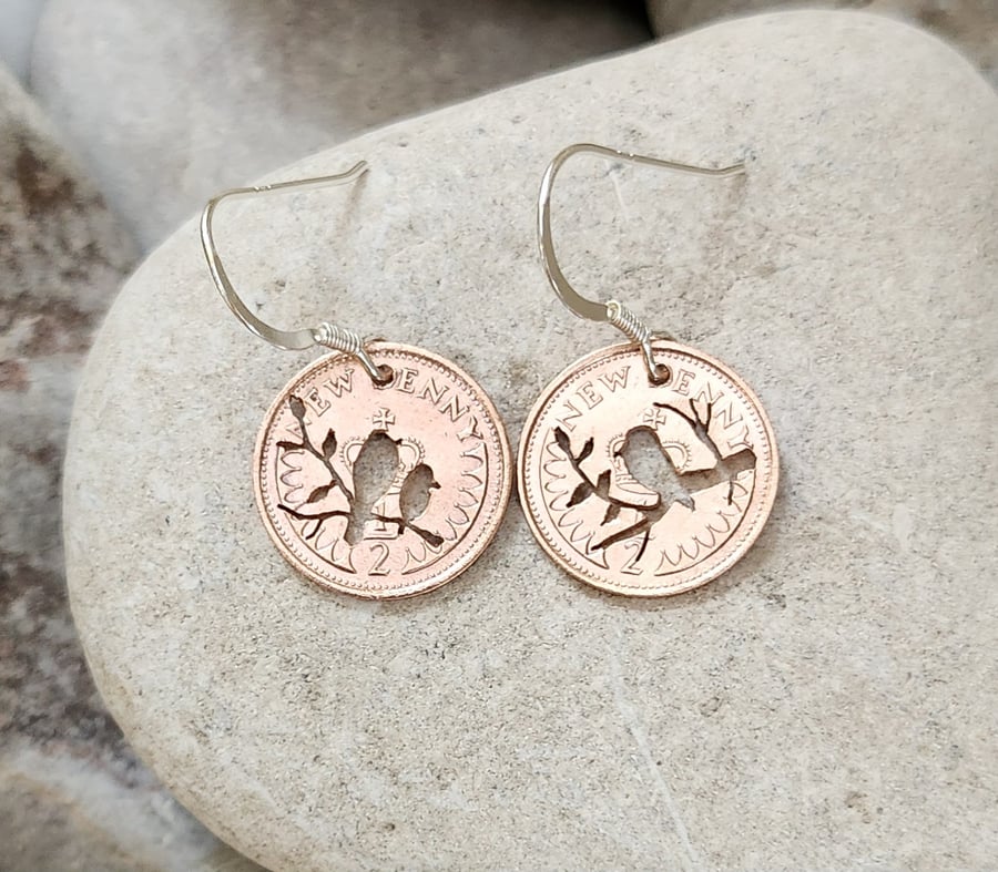 Upcycled coin earrings with bird piercings