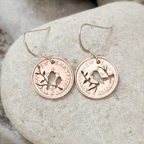 Upcycled coin earrings with bird piercings