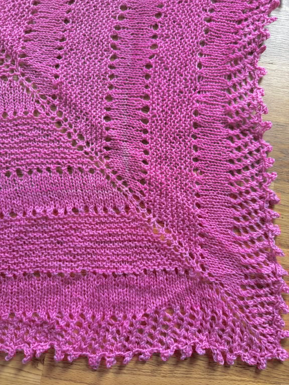 Hand knitted lamswool triangular scarf in hand dyed pink yarn
