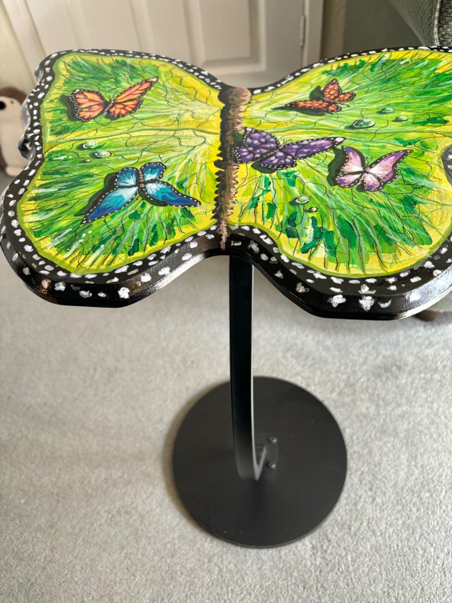 A hand painted and sealed Butterfly side table by Andrew Jenkins 