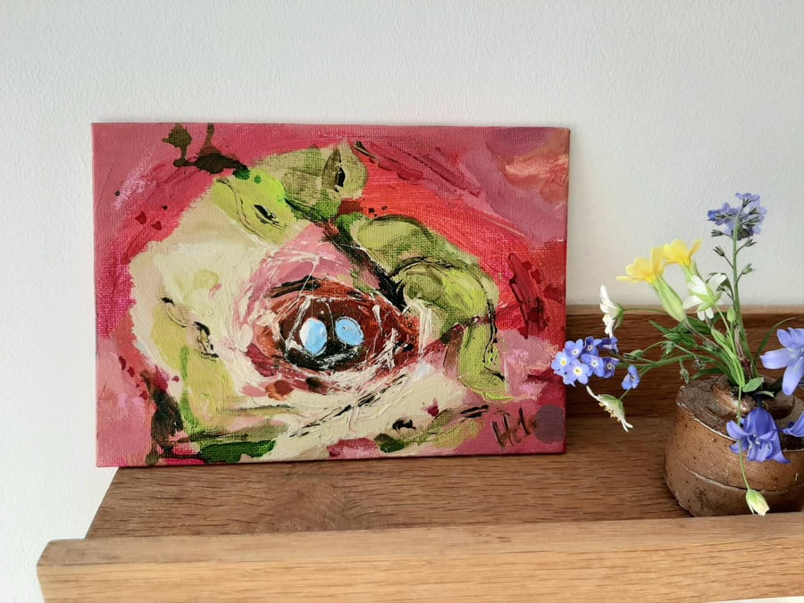 Hot pink nest painting with two blue eggs 