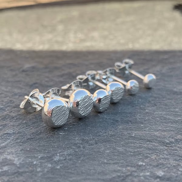 Hammer textured stud earrings, made from recycled silver.