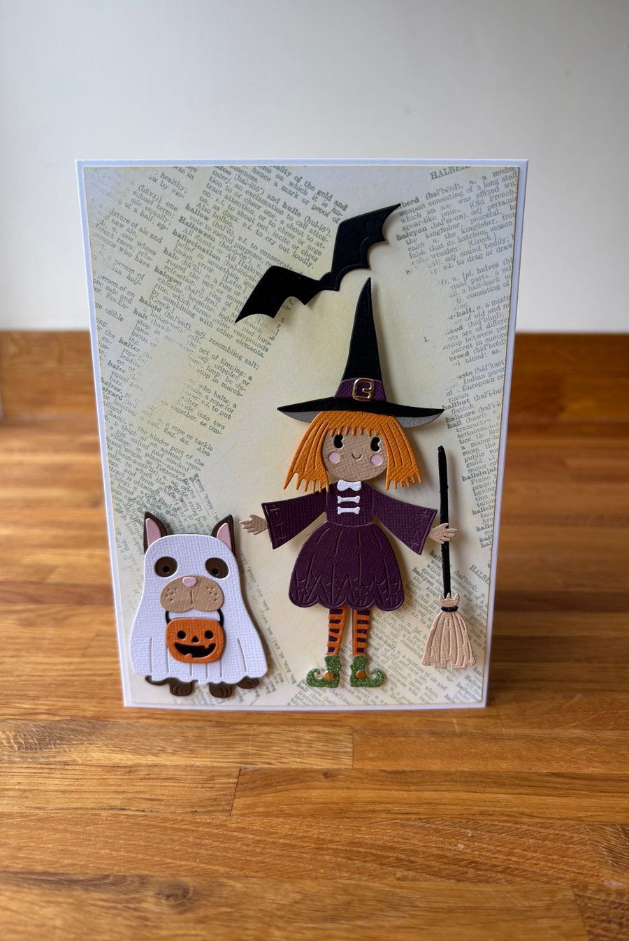 Halloween, witch with her pets mr bat and master woof