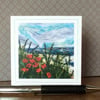 Embroidered seascape with poppies card. 