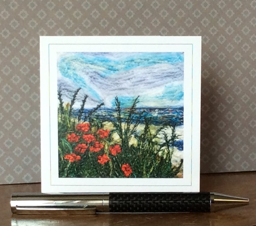 Embroidered seascape with poppies card. 