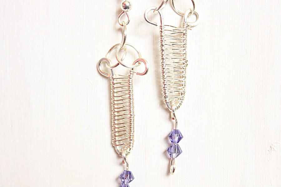 Silver wire wrapped dagger earrings with tanzanite crystal dangles