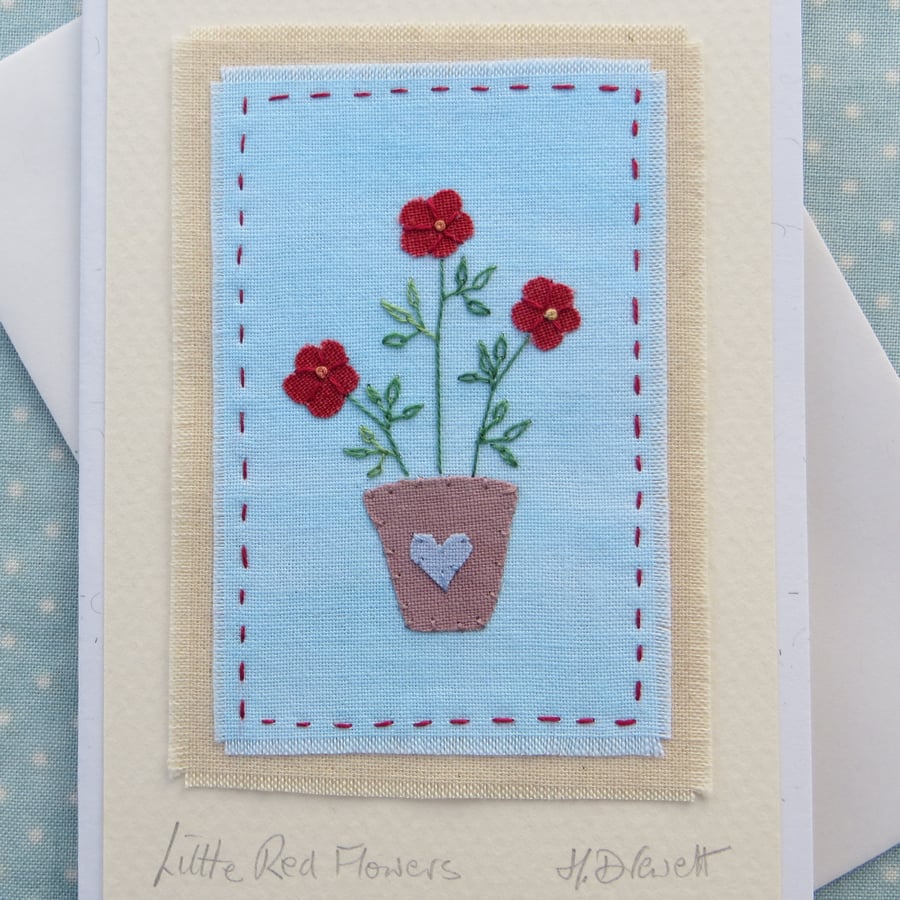 Hand-stitched little red flowers in pot, embroidered leaves and hand dyed cotton