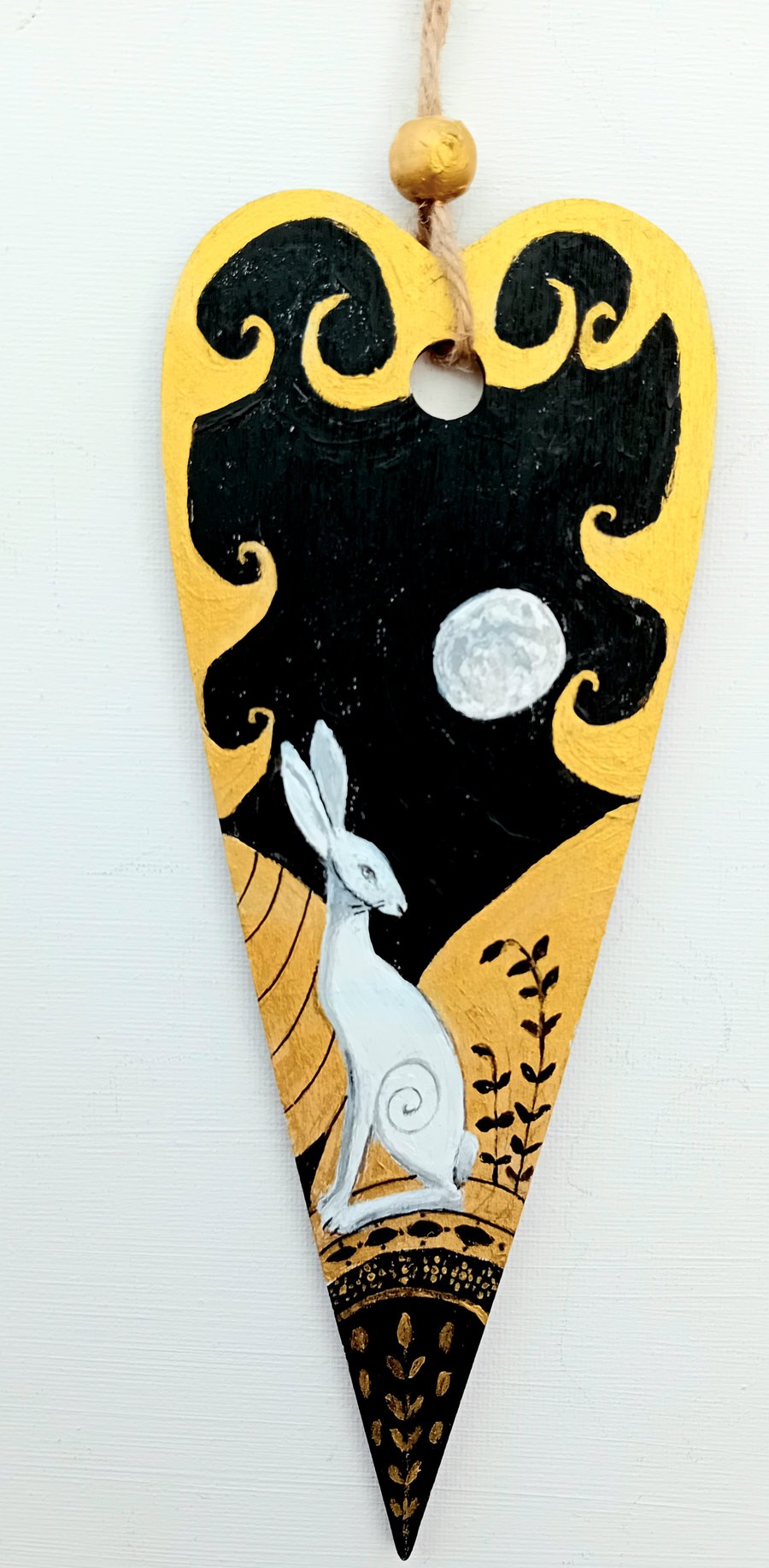 White hare on black and gold