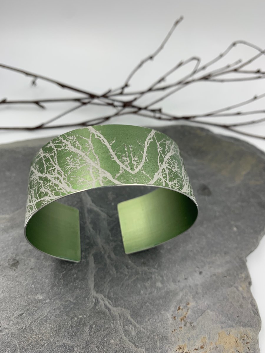 Sage green anodised aluminium ‘Winter Tree’ cuff