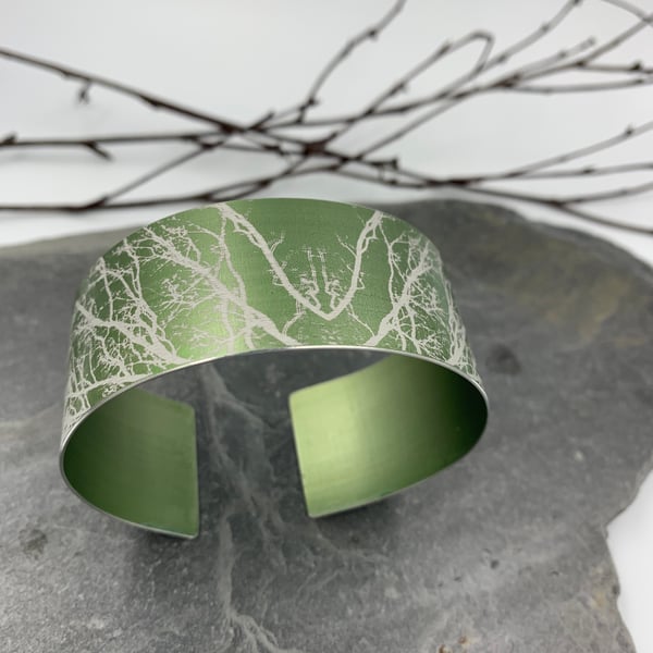 Sage green anodised aluminium ‘Winter Tree’ cuff