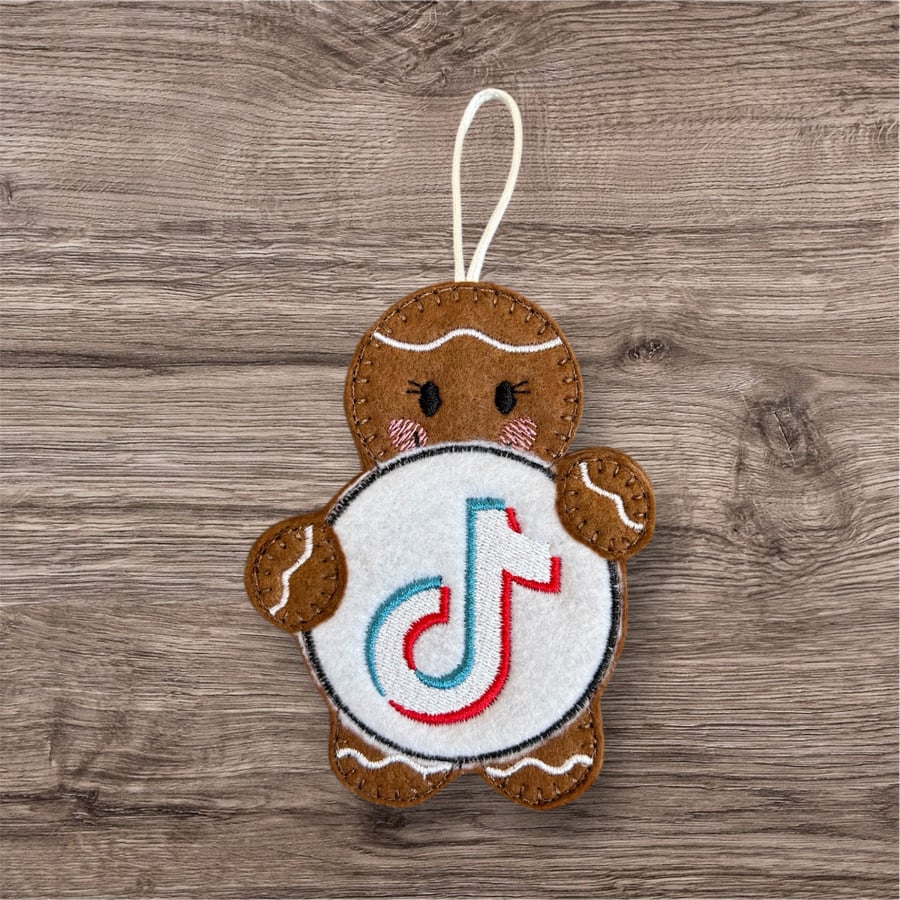 Gingerbread lady holding a TikTok sign Embroidered Hanging Keepsake 