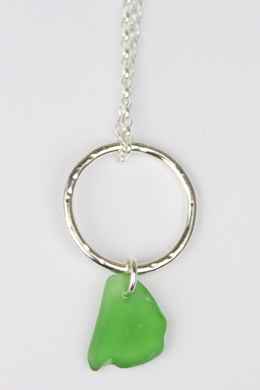 Sterling silver circle necklace with green sea glass