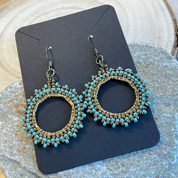 Beaded boho hoop earrings in bronze and blue