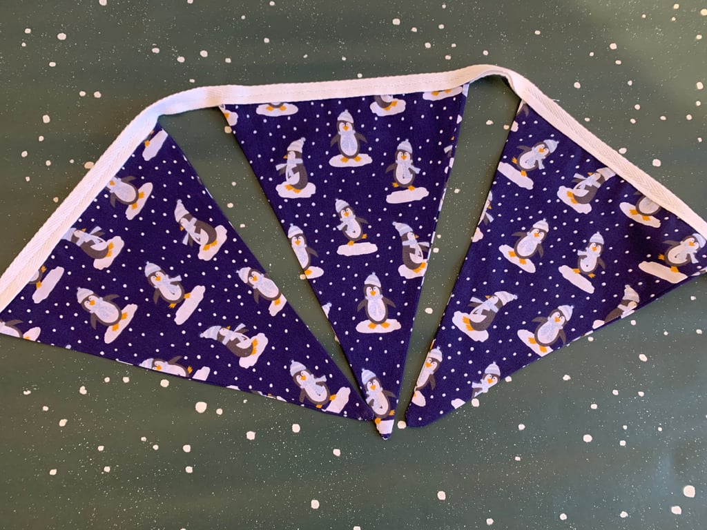 Penguins in the snow bunting 