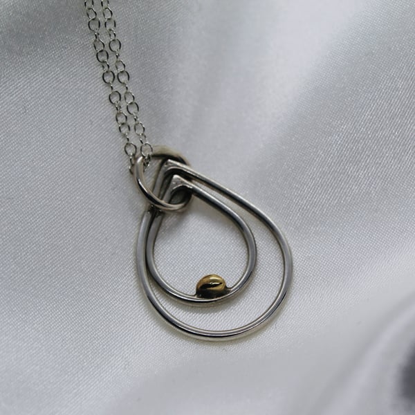 Teardrop shaped silver pendant