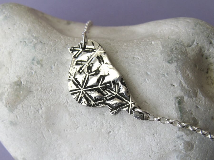 REDUCED! Fine silver necklace with black snowflake pattern