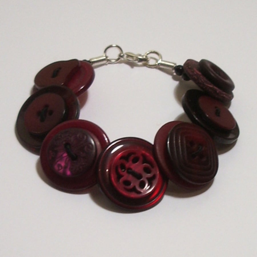 Cherry coloured button bracelet  	