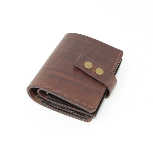 Brown leather wallet with press stud closure