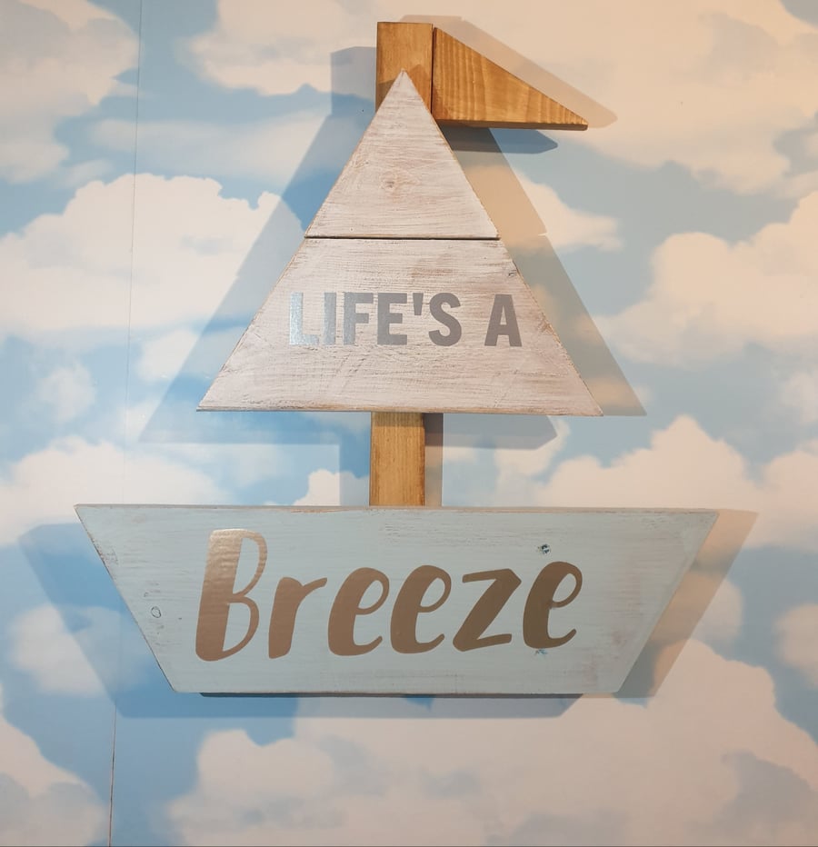 Hanging reclaimed wood boat shaped sign. Lifes a Breeze, nautical sail boat