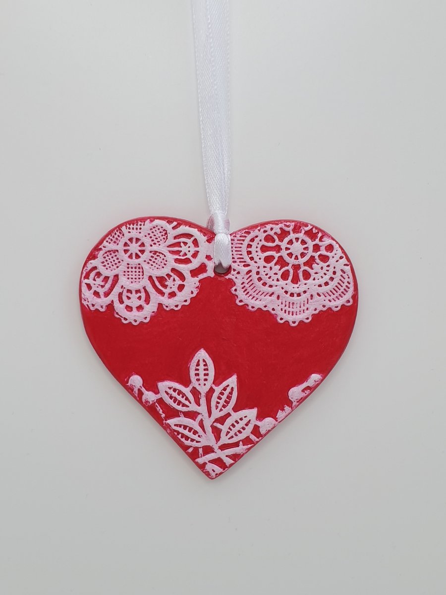 Red heart hanging decoration with textured lace pattern, anniversary gift