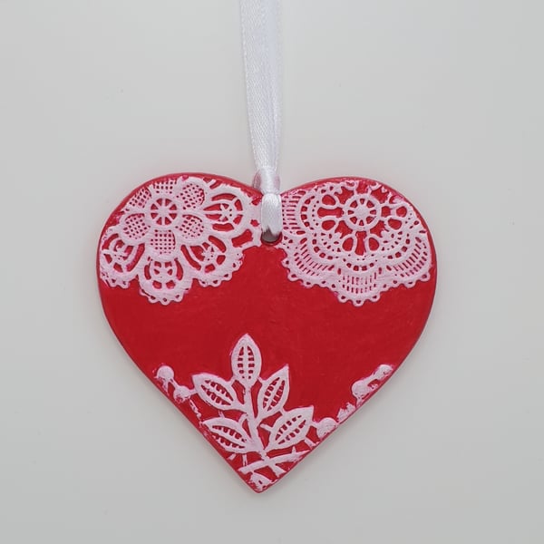 Red heart hanging decoration with textured lace pattern, anniversary gift