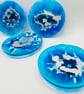 Blue and silver resin round coasters 