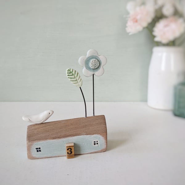 Little Wooden House with Clay Flower and Bird