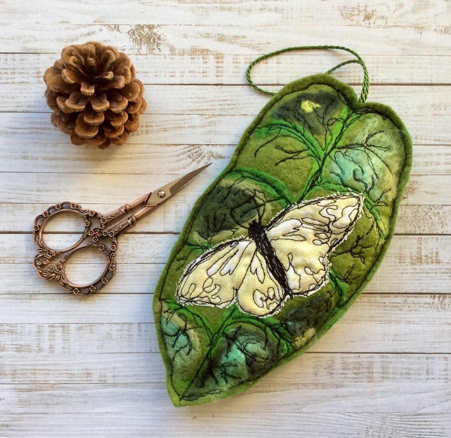 Embroidered leaf with butterfly home decoration. 