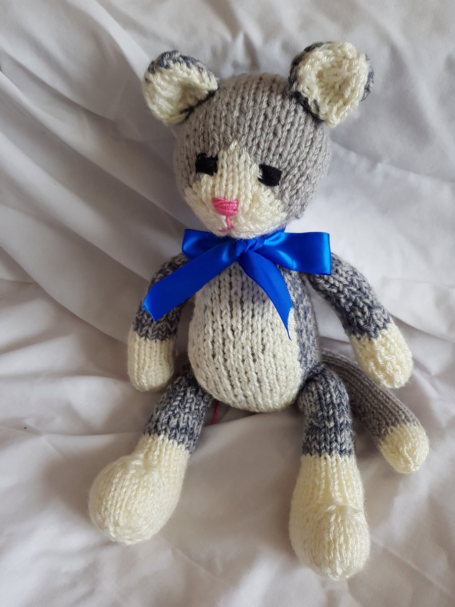 Hand knitted soft doll cat