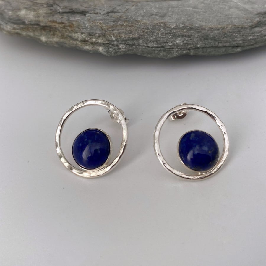 Open circle silver stud earrings with a blue Lapis Lazuli stone set inside