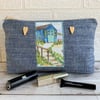 Large blue make up bag with beach hut decorative panel