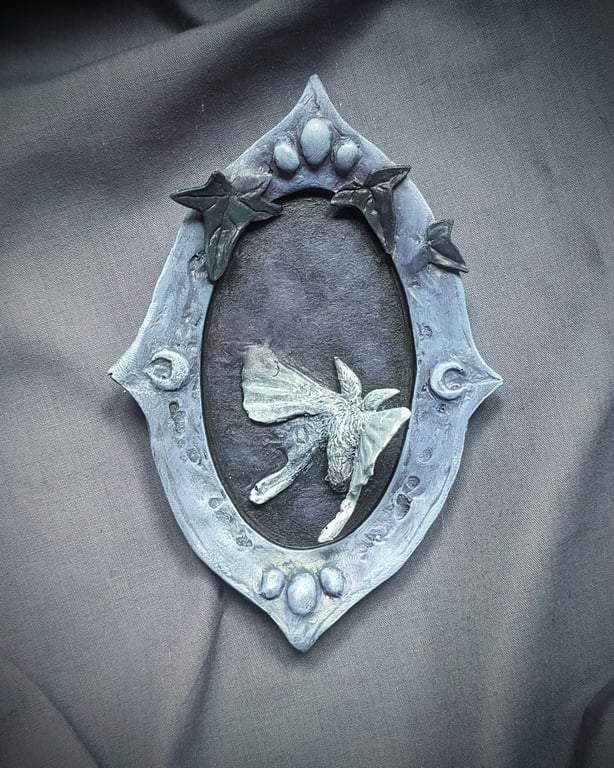 Unseen v - small, strange, beautiful moth and mirror sculpture