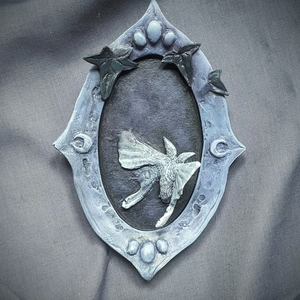 Unseen v - small, strange, beautiful moth and mirror sculpture