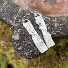 Silver and peridot mismatched earrings