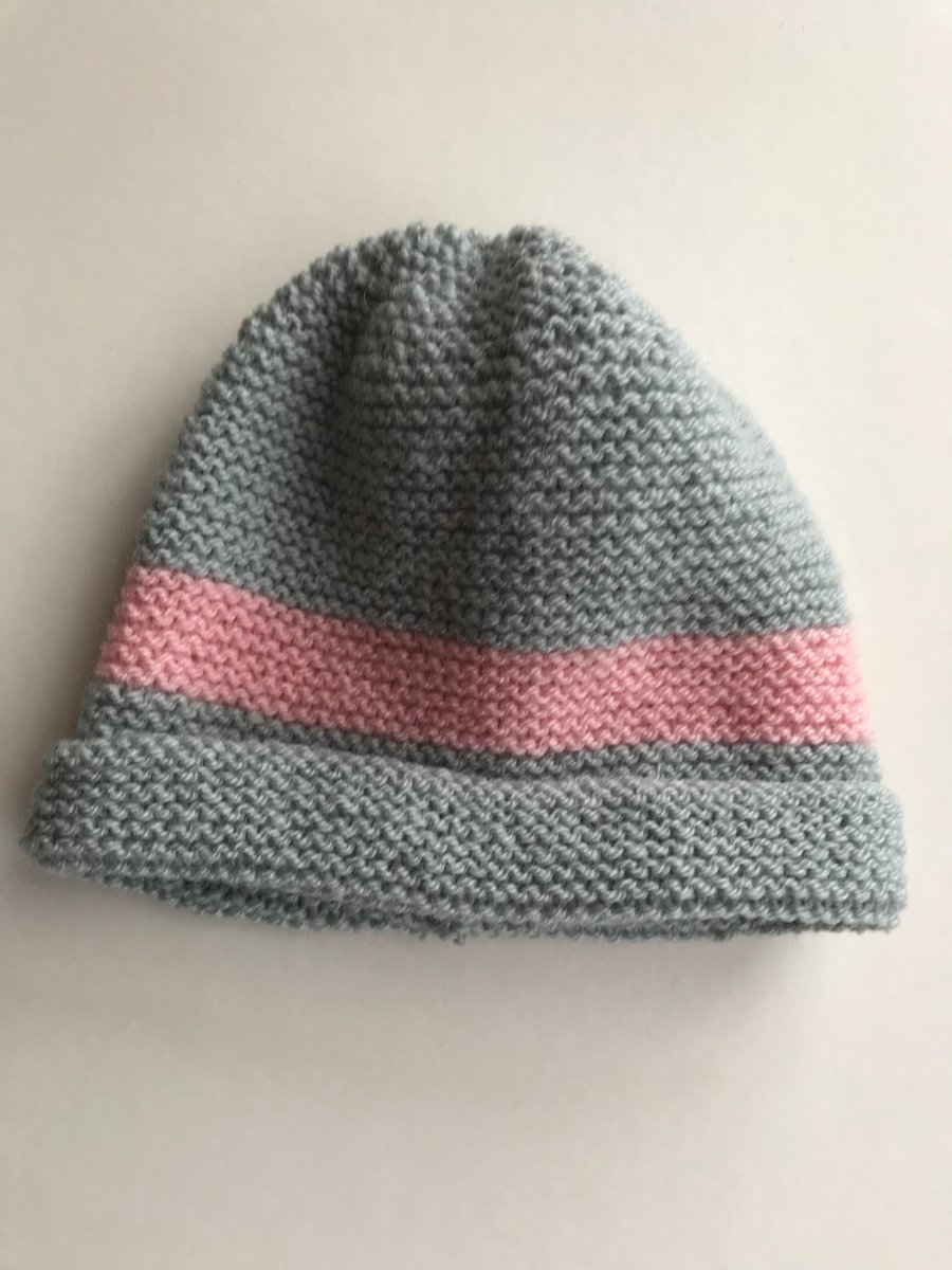 Grey hand knitted hat with a pink stripe