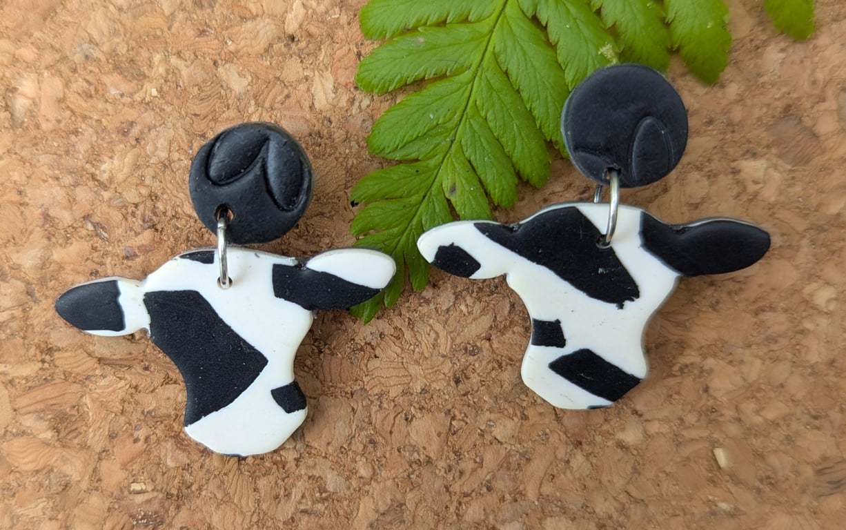 Title: Classic Black & White Cow Print Drop Earrings - Handmade Polymer Clay
