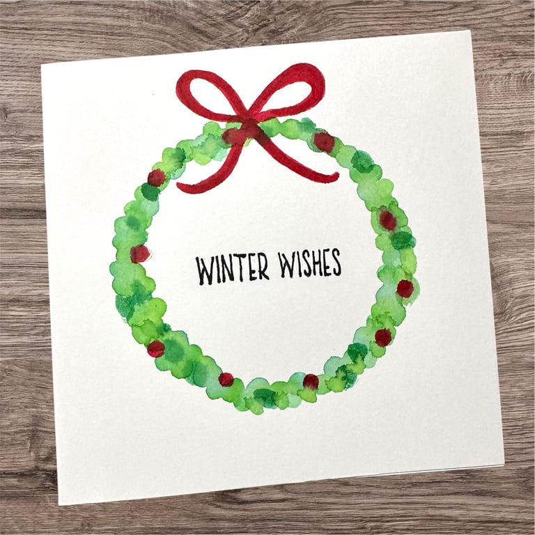 A Christmas Holly and berry wreath, hand painted watercolour Christmas card 