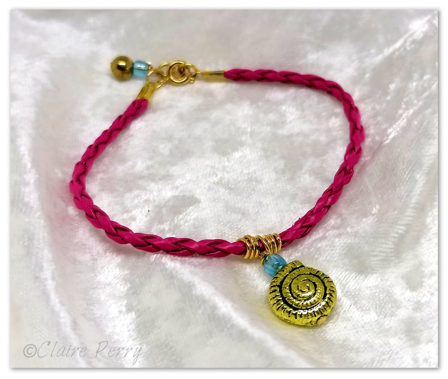 Bracelet Hot pink Faux Leather with gold plated Seashell charm bead.