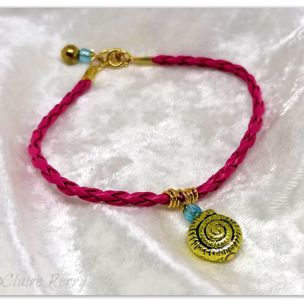 Bracelet Hot pink Faux Leather with gold plated Seashell charm bead.