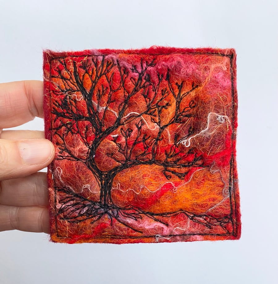 Tree silhouette with sunrise, original wet felting artwork.