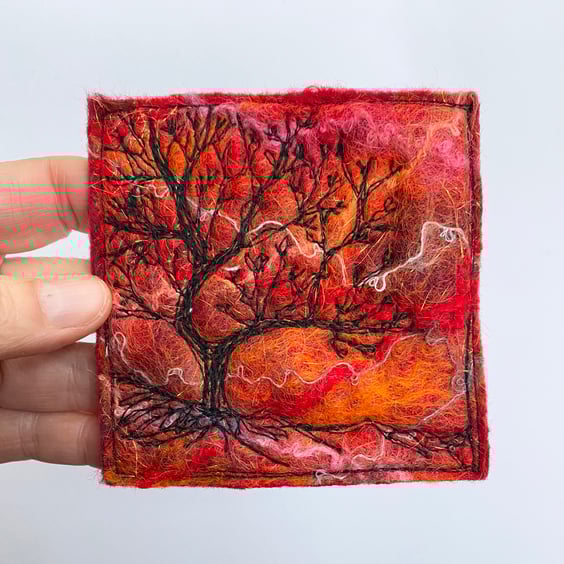 Tree silhouette with sunrise, original wet felting artwork.