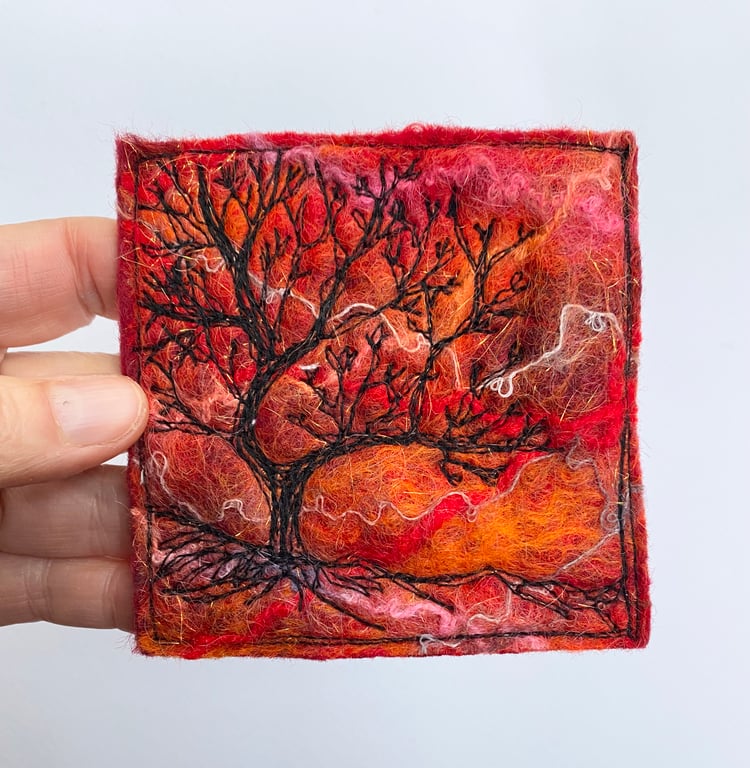 Tree silhouette with sunrise, original wet felting artwork.