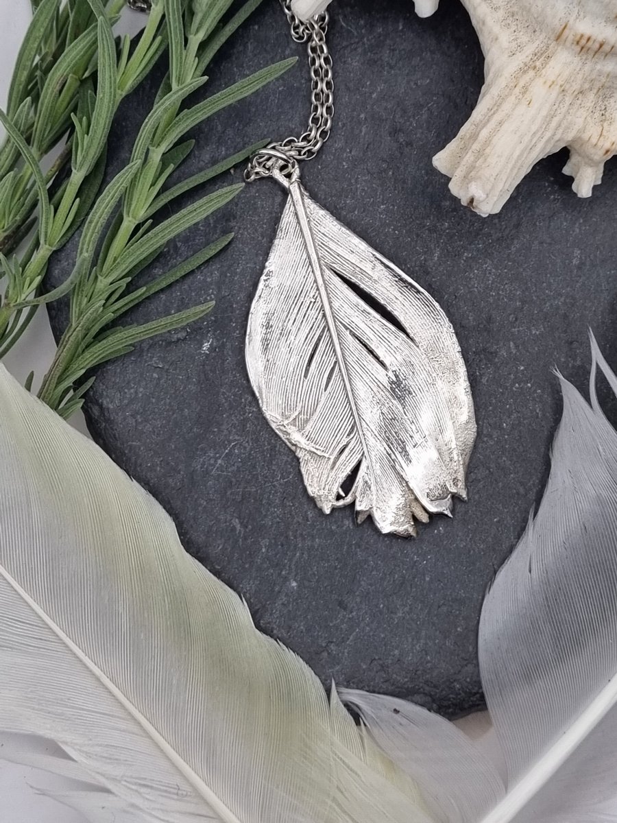 Real feather preserved in silver pendant necklace