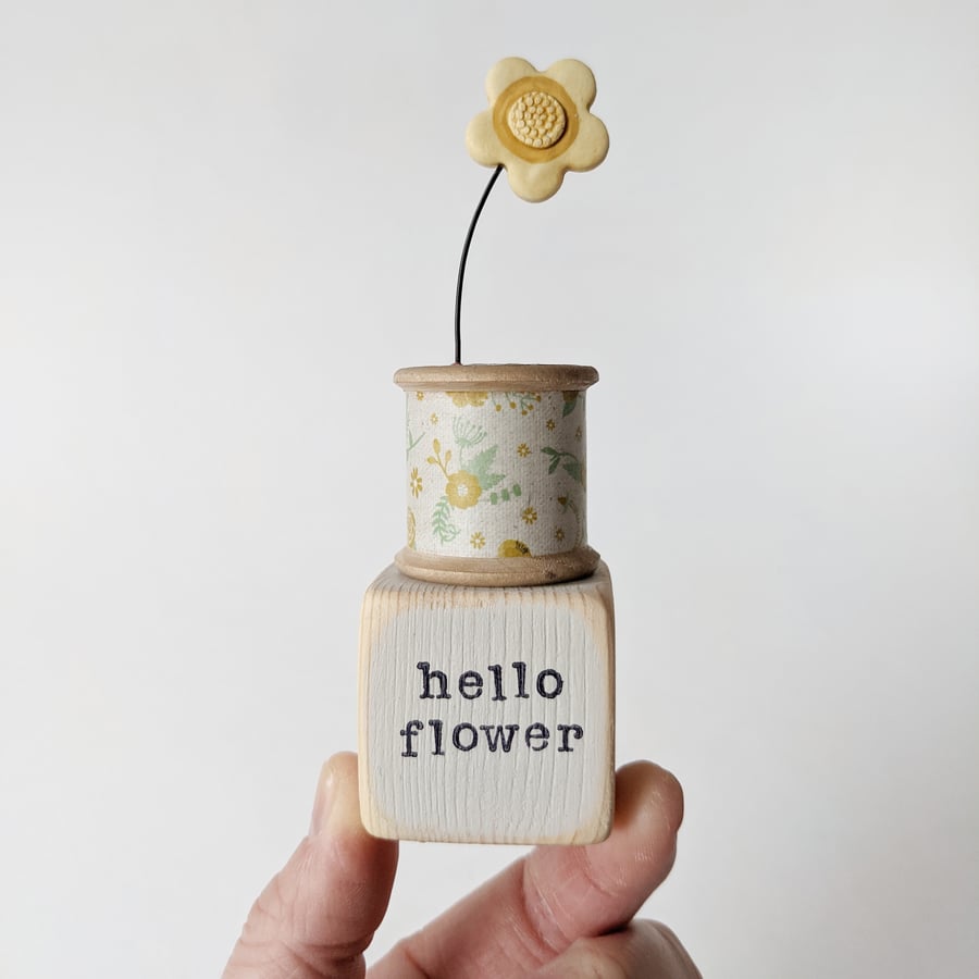 Clay Flower on a Vintage Bobbin 'hello flower'