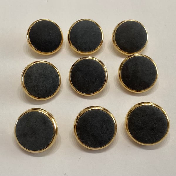 Set of nine buttons, matt grey centres with gold  coloured edges.