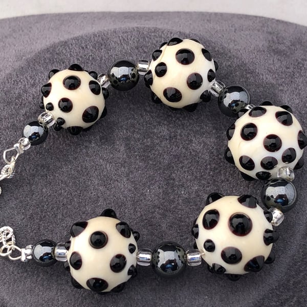 cream ivory and black lampwork glass beaded necklace with haematite stones