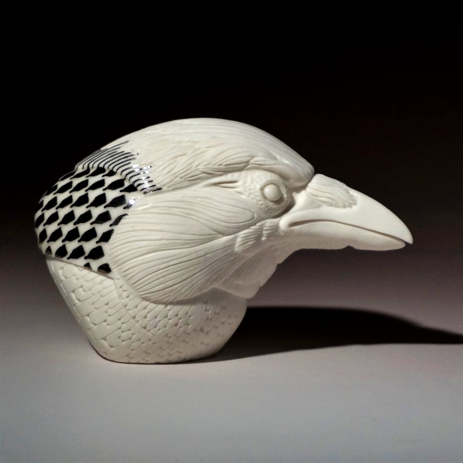 Selsyn, hand carved porcelain crow head.