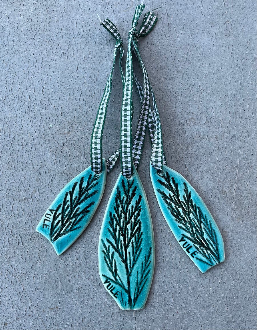 Set of three ceramic Yule decorations .